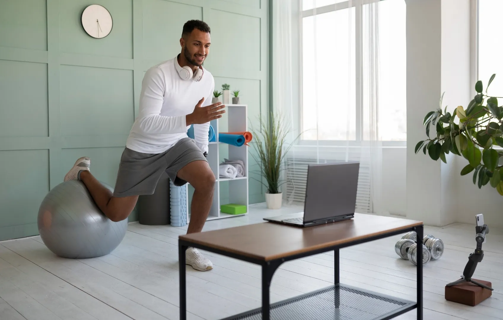6 Fascial Fitness Training Principles to Boost Mobility, Strength & Recovery - A man taking an online Fascial Fitness Class